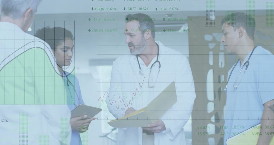 Medical Team Analyzing Charts with Modern Technology in Hospital Environment