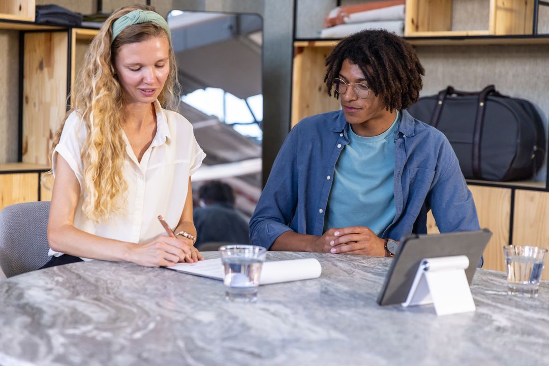 Diverse Team Collaborating in Modern Showroom Workspace