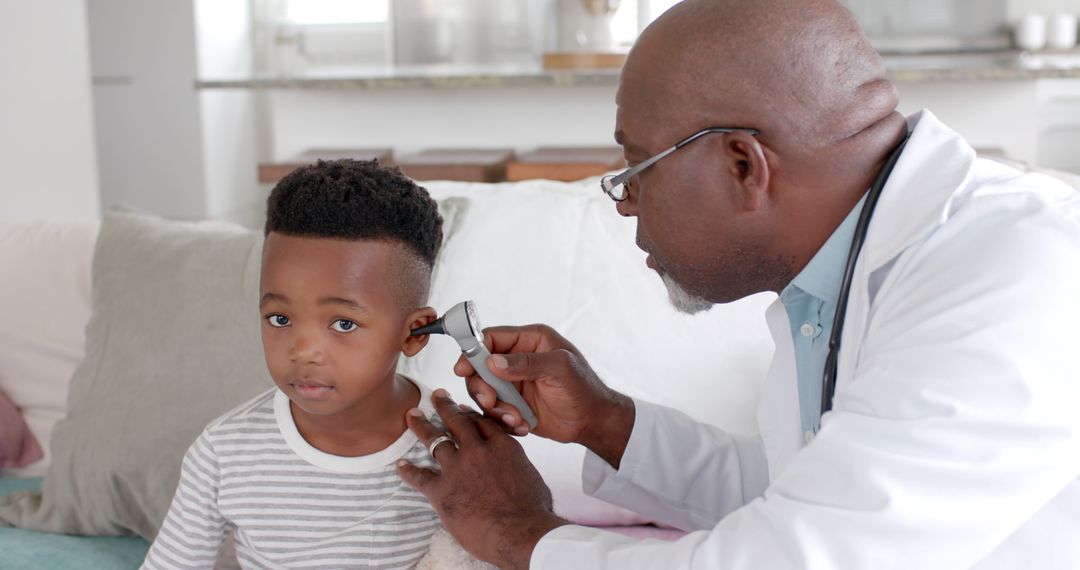 Doctor Using Otoscope to Examine Child's Ear at Home - Free Images, Stock Photos and Pictures on Pikwizard.com