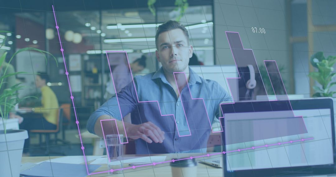 Businessman Analyzing Financial Graphs in Modern Office