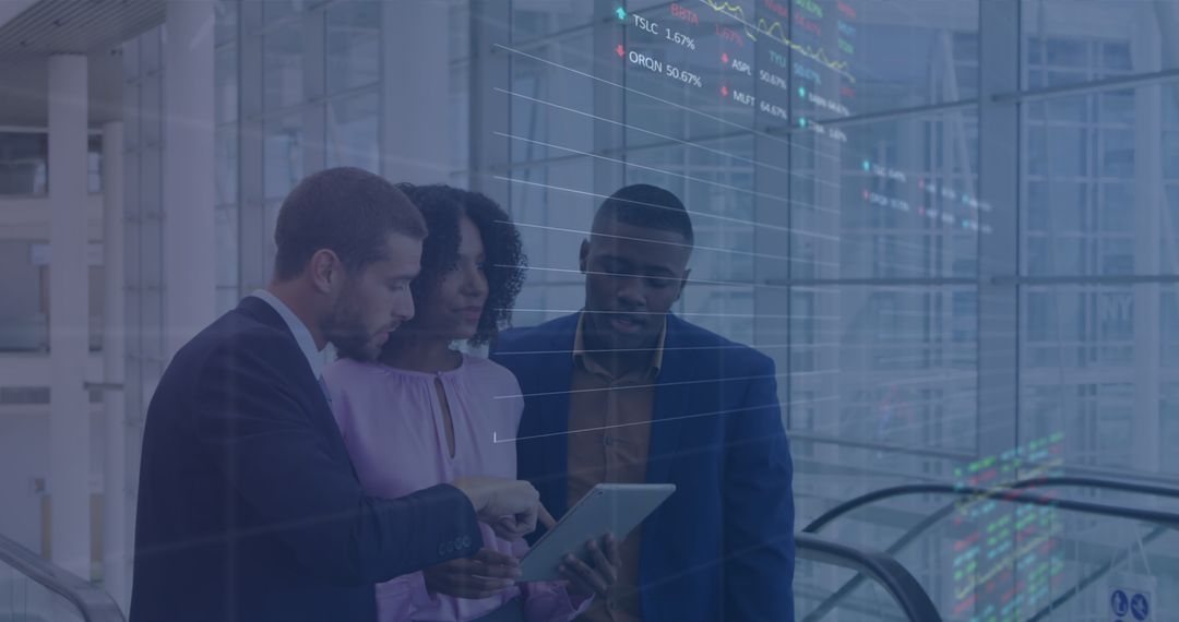 Diverse Business Team Analyzing Stock Market Data on Tablet