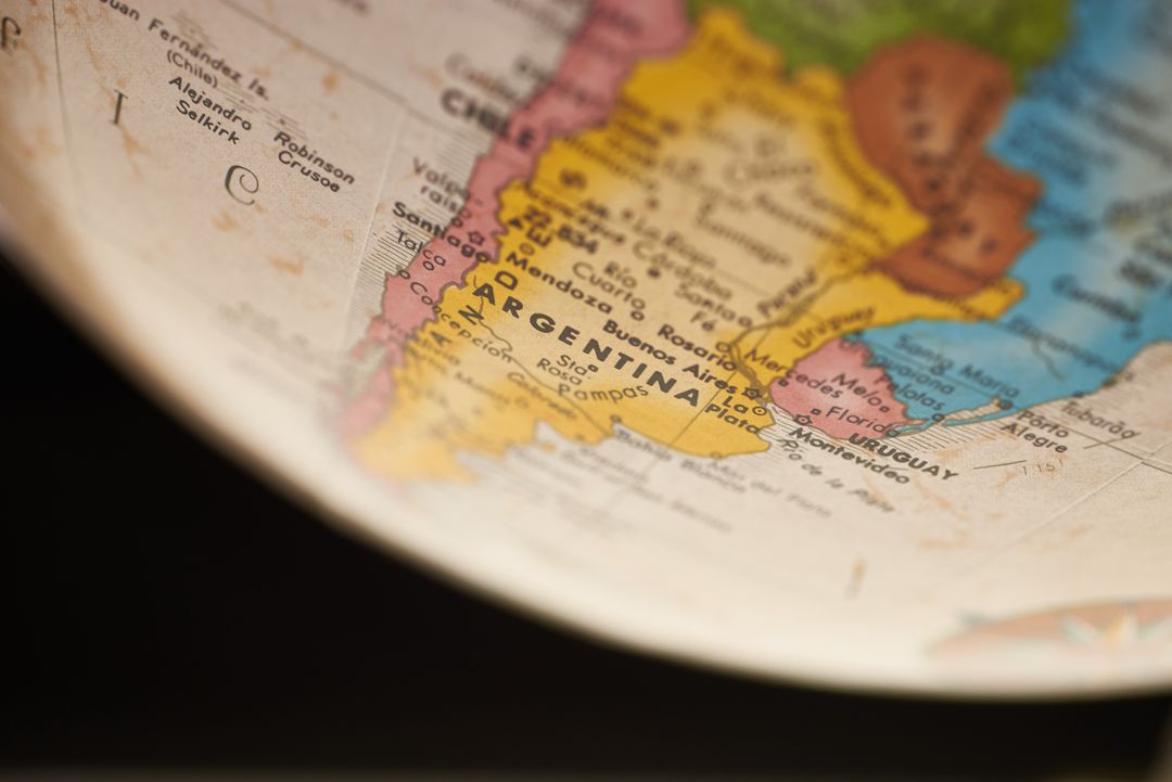 Focusing on Argentina and Uruguay on vintage globe map close-up for travel education