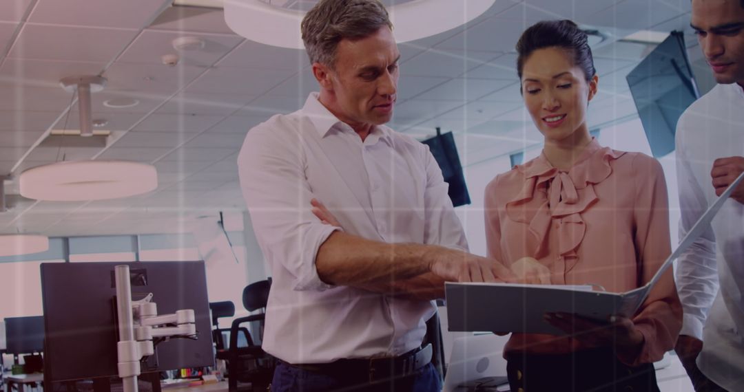 Business Team Engaged in Digital Data Processing Discussion