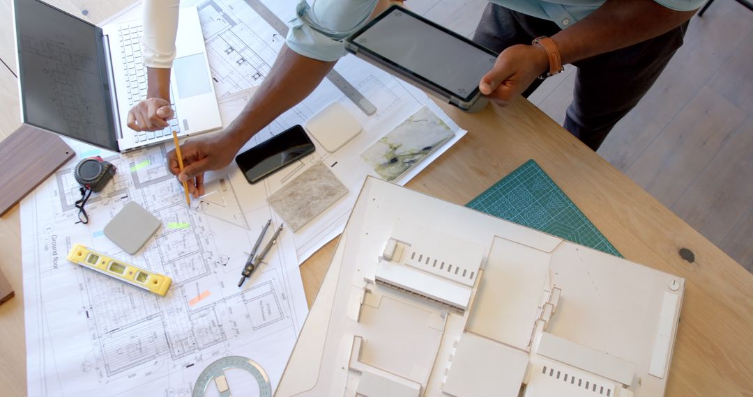 Architects Collaborating on Detailed Construction Project Plans