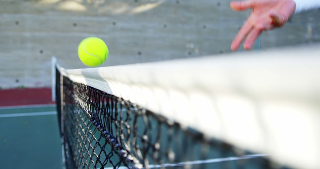 Close-up Tennis Ball Bouncing Over Net During Daytime Match - Free Images, Stock Photos and Pictures on Pikwizard.com