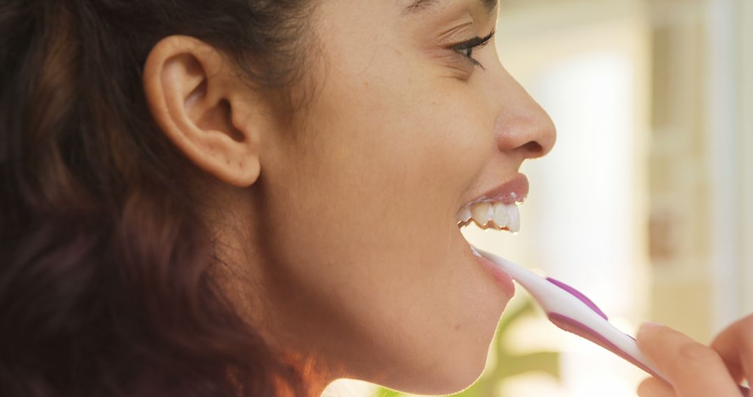 Close-up of Smiling Woman Brushing Teeth for Morning Routine - Free Images, Stock Photos and Pictures on Pikwizard.com