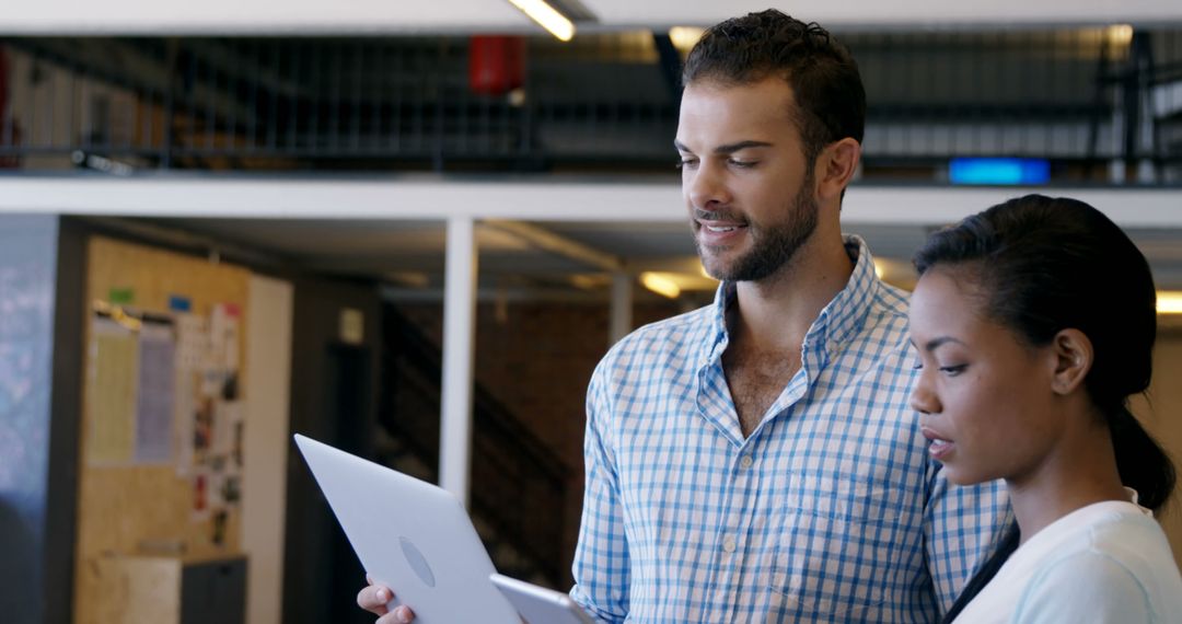 Collaboration Between Colleagues in Modern Office Environment