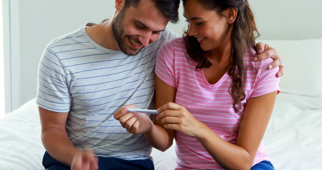 Joyful Couple Discovering Pregnancy Result at Home