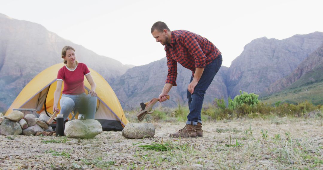 Couple Setting Up Campsite in Scenic Mountain Area - Free Images, Stock Photos and Pictures on Pikwizard.com