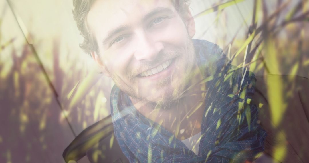 Double Exposure of Smiling Man in Nature Setting