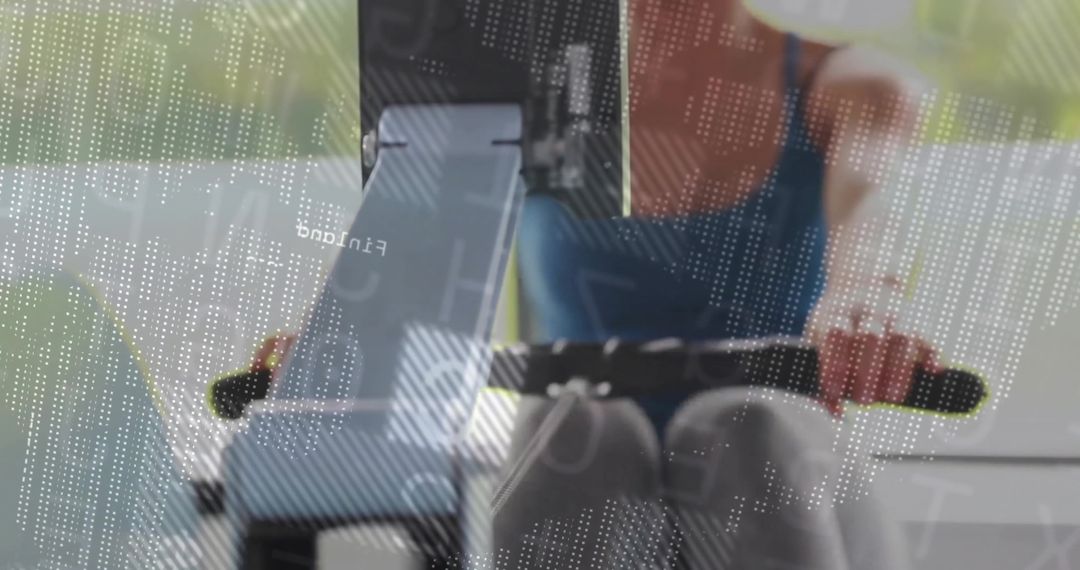Woman Rowing in Gym with Digital Interface Overlay