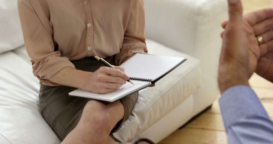 Female Therapist Taking Notes During a Counseling Session - Free Images, Stock Photos and Pictures on Pikwizard.com