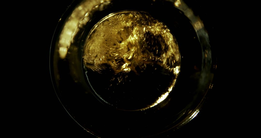 Golden Liquid Splash in Dark Background Top View Art - Free Images, Stock Photos and Pictures on Pikwizard.com