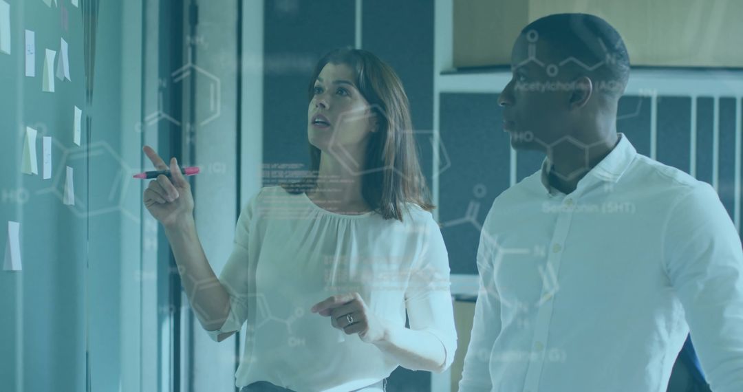 Diverse Team Discussing Data and Chemical Formulas in Modern Office