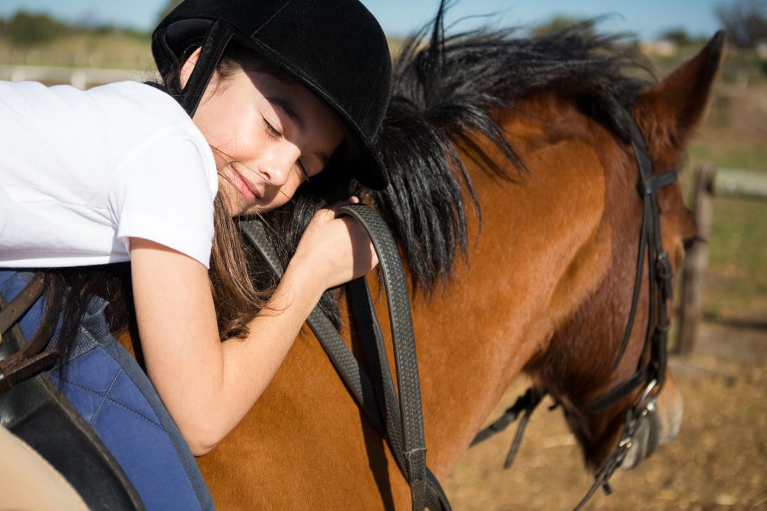 Cute girl embracing horse in the ranch - Free Images, Stock Photos and Pictures on Pikwizard.com
