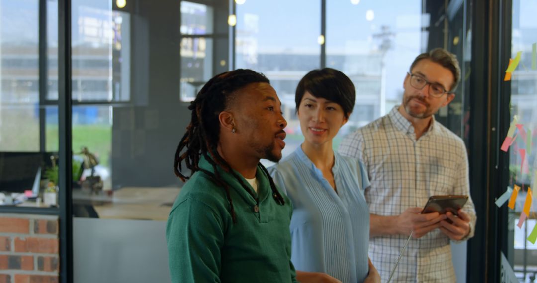 Corporate Team Engaging in Thoughtful Discussion in Modern Office