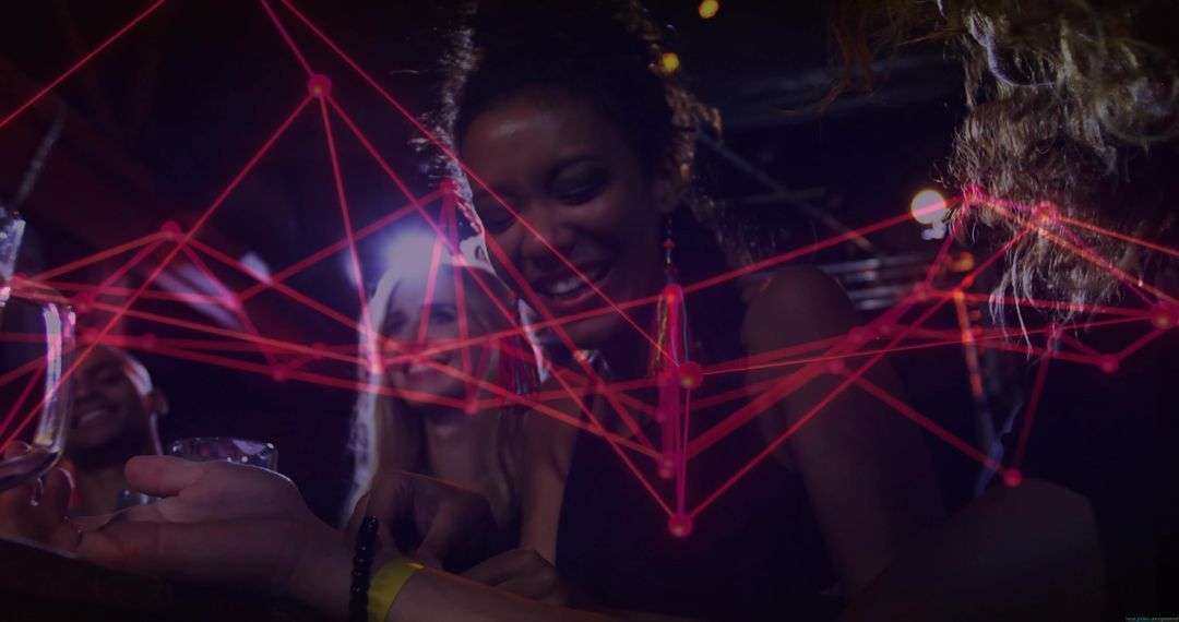 Friends Laughing at Bar with Red LED Overlay