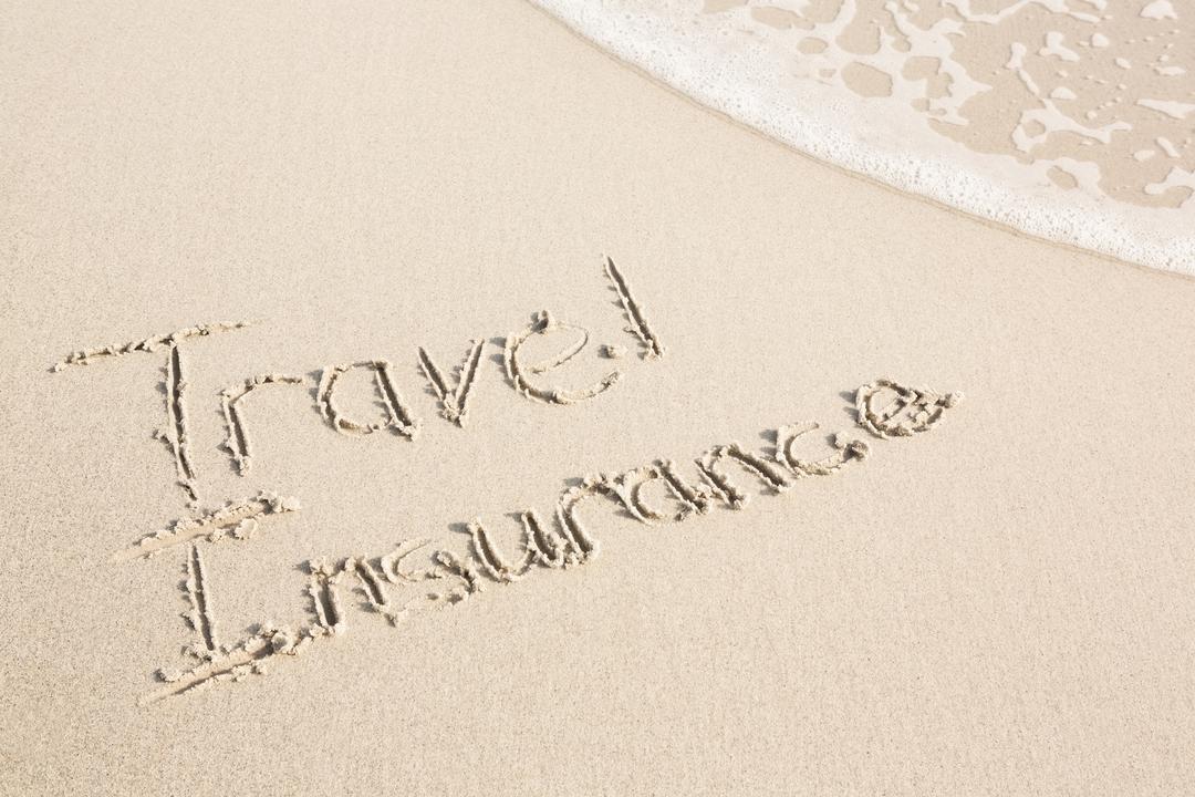 Travel Insurance Written on Sandy Beach - Free Images, Stock Photos and Pictures on Pikwizard.com