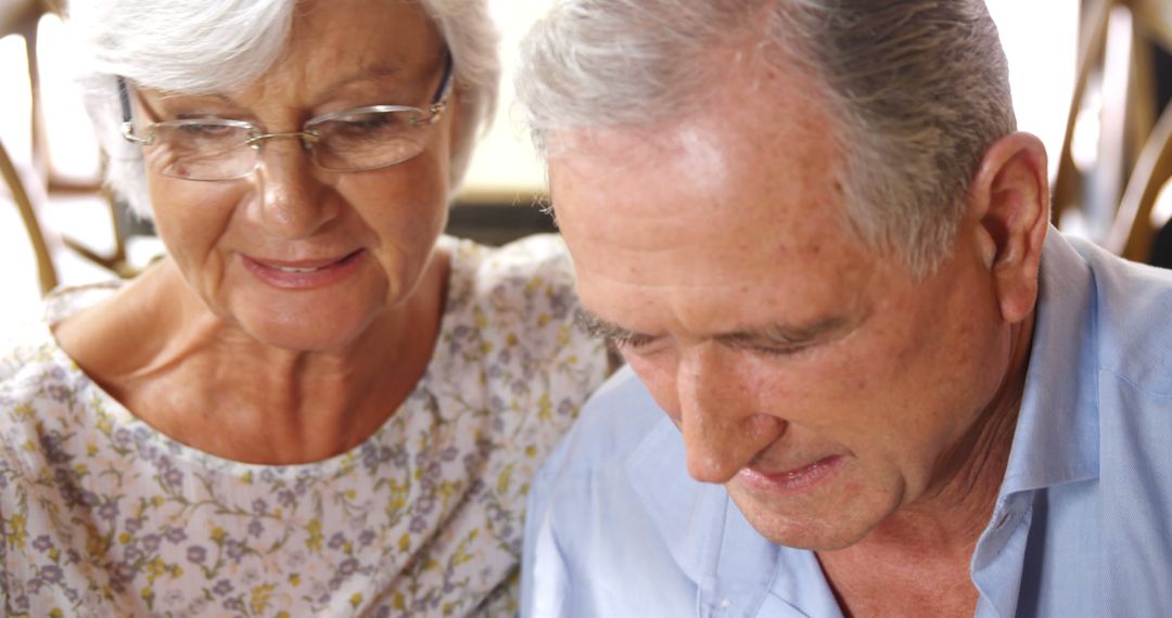 Senior Couple Concentrating on Home Task