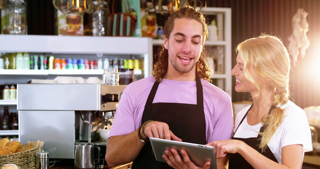 Cafe Waitstaff Collaborating With Digital Tablet