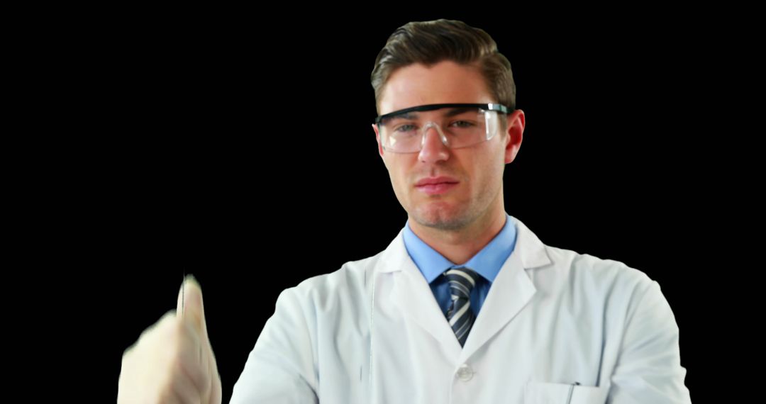 Male Scientist Wearing Protective Eyewear and Lab Coat - Free Images, Stock Photos and Pictures on Pikwizard.com