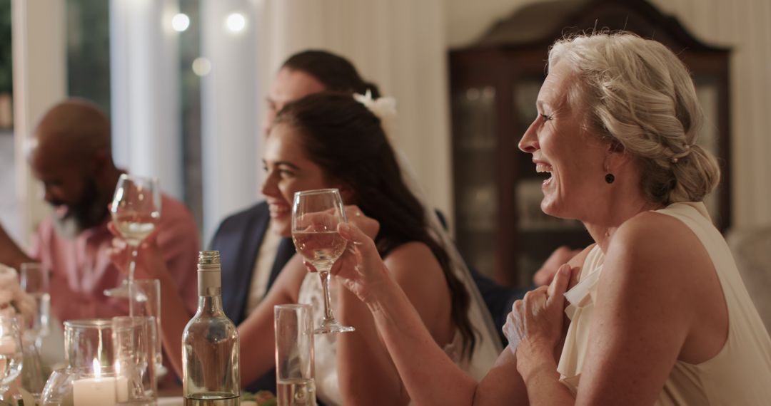 Elegant Wedding Reception with Joyful Guests Enjoying Dinner