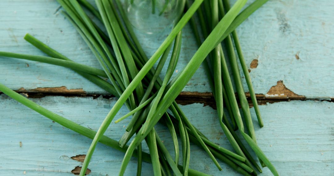 Fresh Chives on Rustic Blue Wooden Background with Copy Space - Free Images, Stock Photos and Pictures on Pikwizard.com