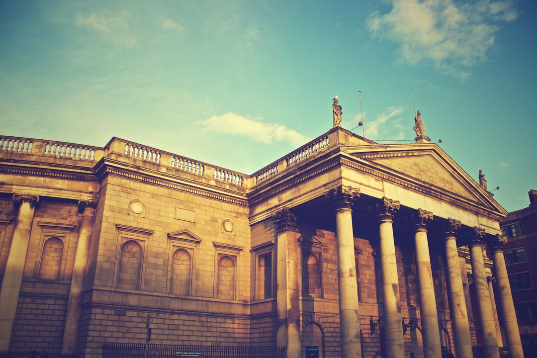 Historic European Building with Columns under Blue Sky at Sunset - Free Images, Stock Photos and Pictures on Pikwizard.com