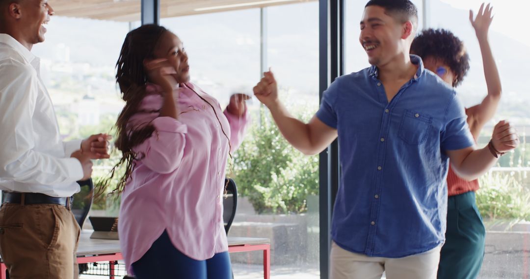 Diverse Team Celebrating Achievement with Joyful Dance