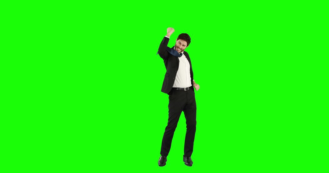 Confident Businessman Celebrating Success on Green Screen - Free Images, Stock Photos and Pictures on Pikwizard.com