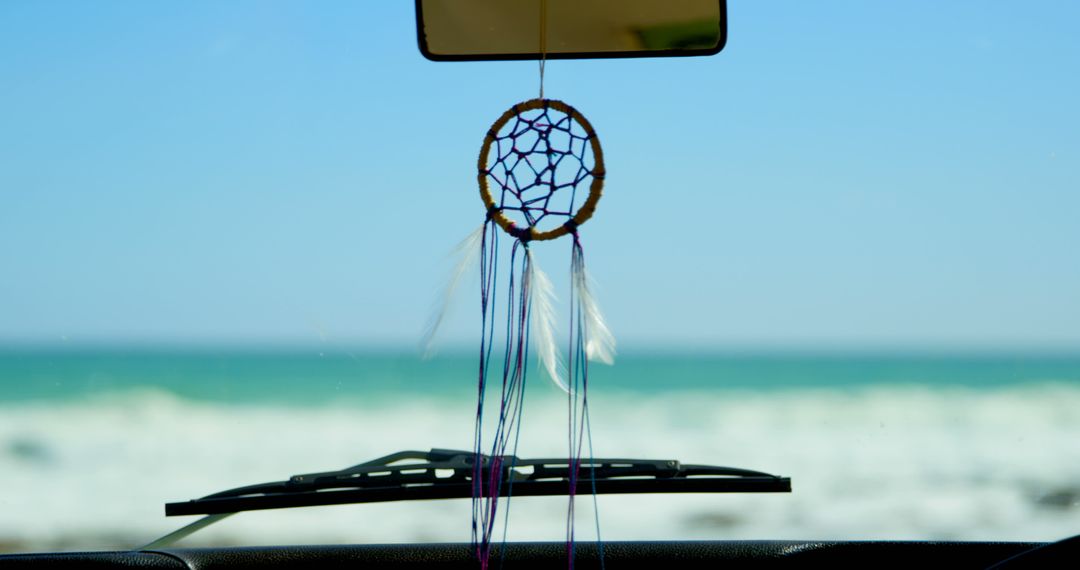 Dreamcatcher Hanging in Car with Ocean View - Free Images, Stock Photos and Pictures on Pikwizard.com