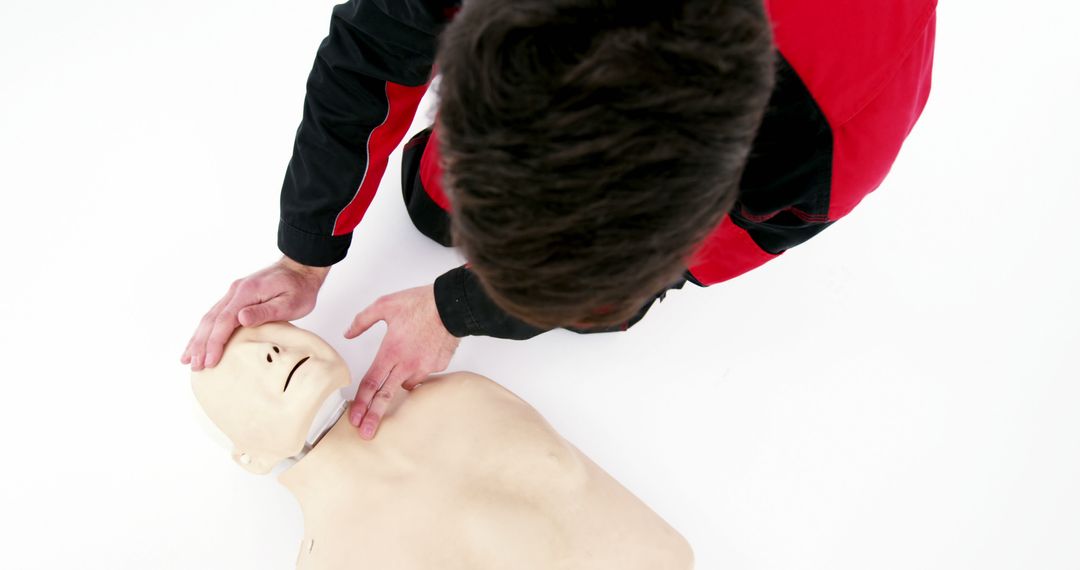 Paramedic Demonstrating CPR Training Using Mannequin - Free Images, Stock Photos and Pictures on Pikwizard.com