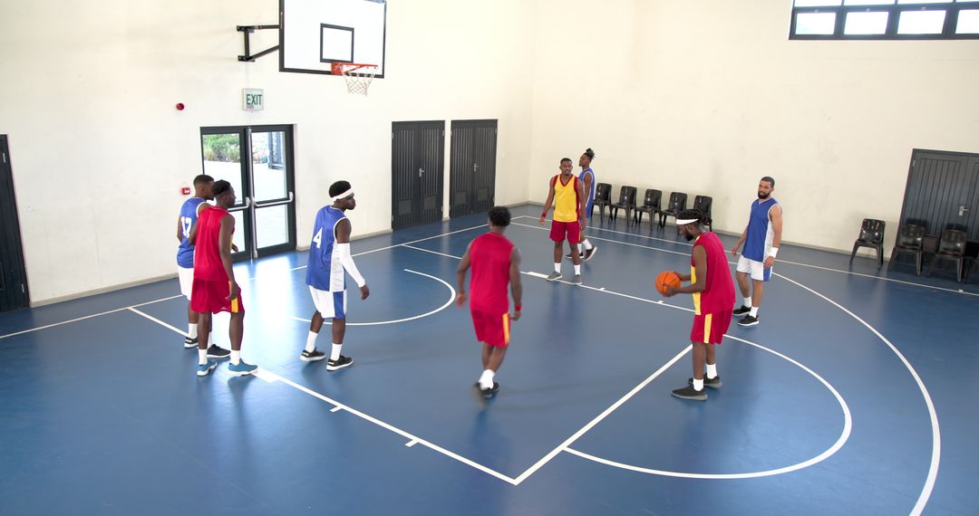 Diverse Male Basketball Teamman Navigating Game Strategies Indoors