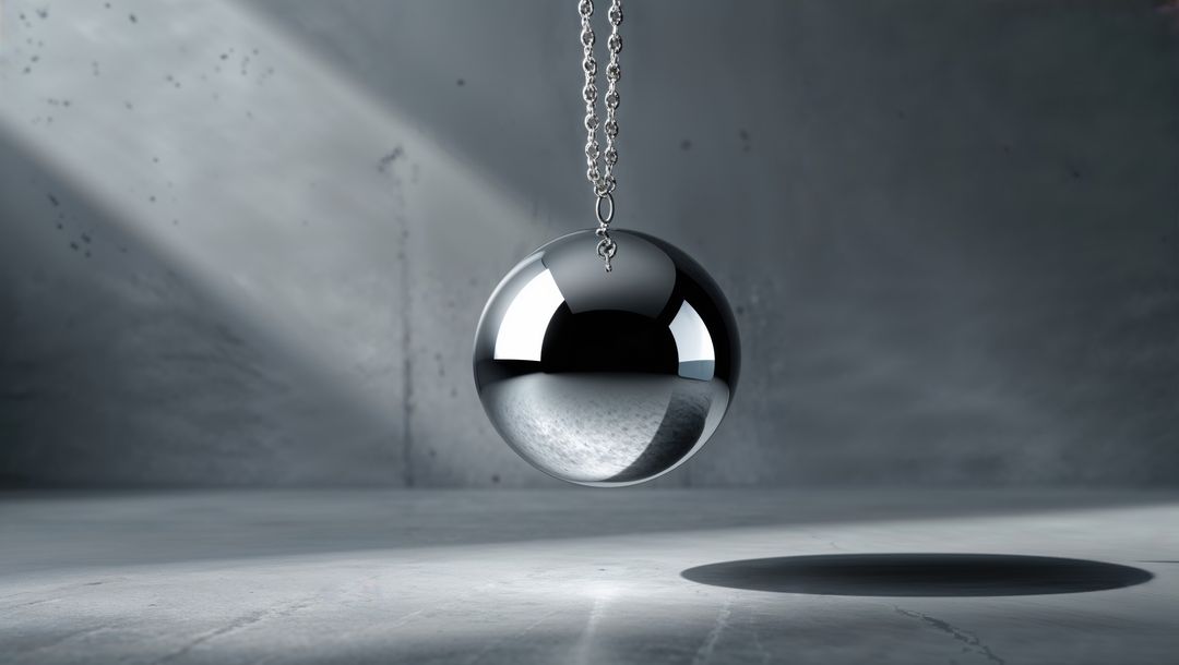 Floating reflective chrome wrecking ball in minimal concrete room
