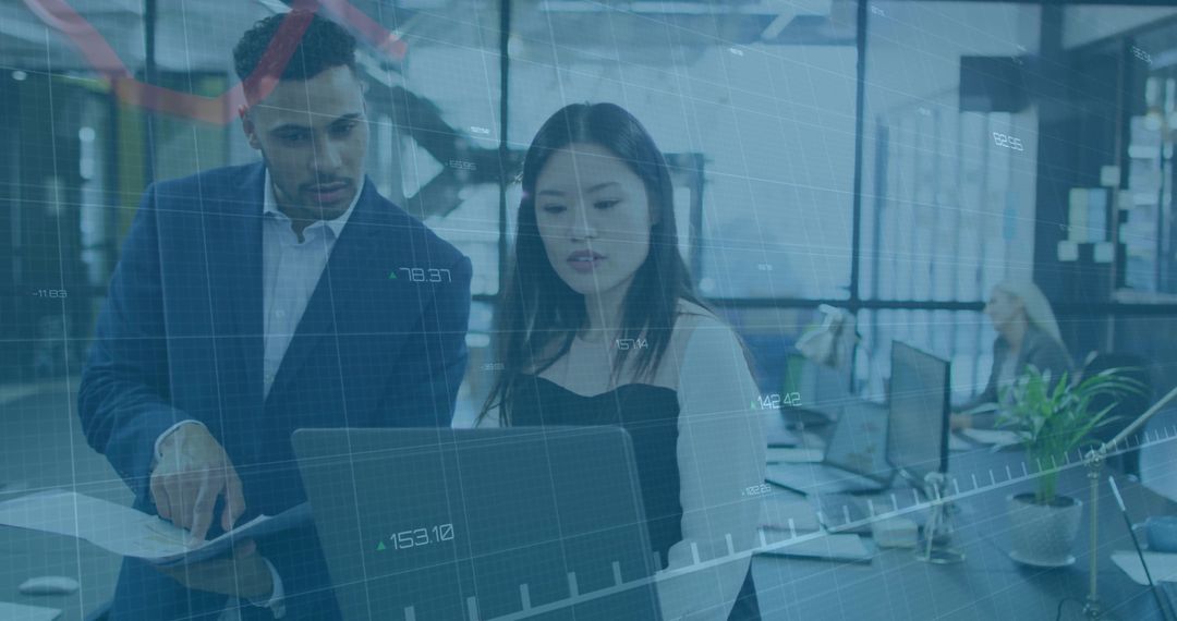 Business Professionals Analyzing Data Together in Modern Office