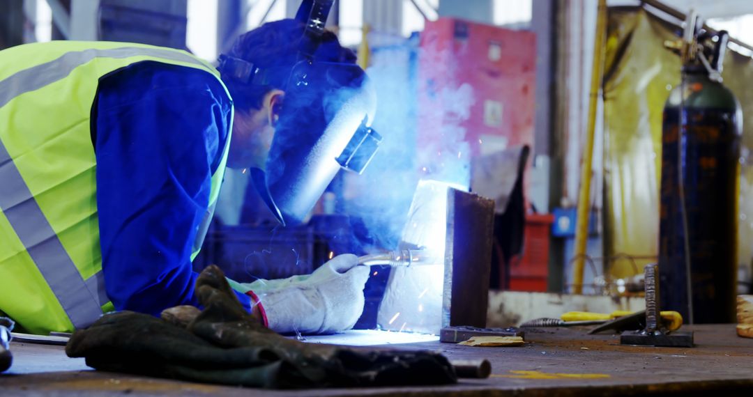 Welder Demonstrating Precision Metalwork in Industrial Workshop - Free Images, Stock Photos and Pictures on Pikwizard.com