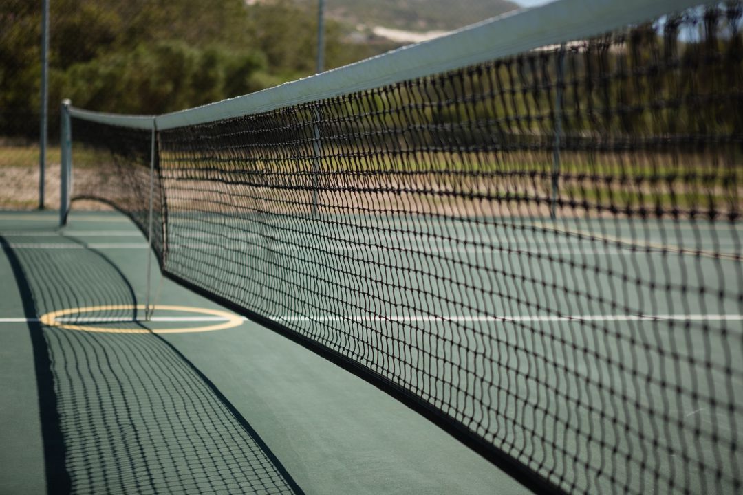 Close-Up of Tennis Court Net on Sunny Day - Free Images, Stock Photos and Pictures on Pikwizard.com