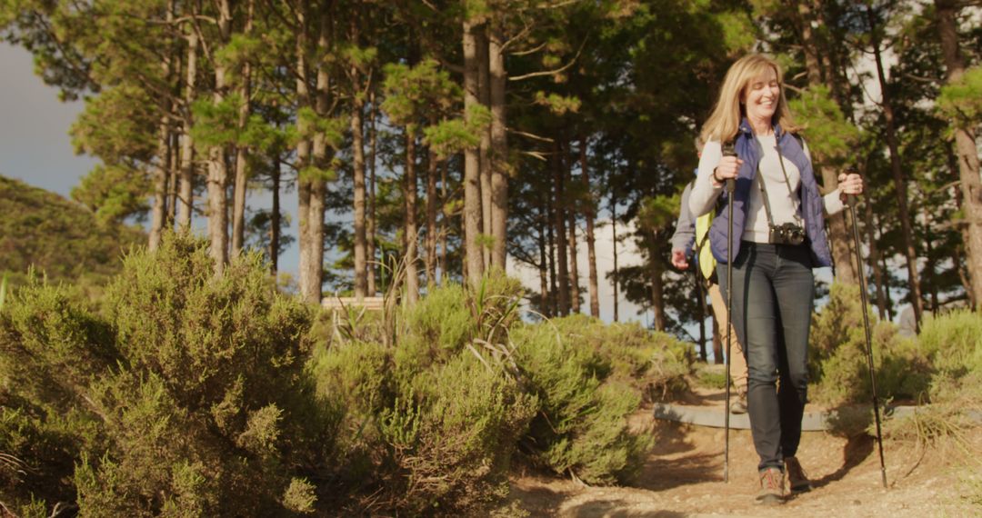 Mature Woman Enjoying Hiking Trail in Forest - Free Images, Stock Photos and Pictures on Pikwizard.com