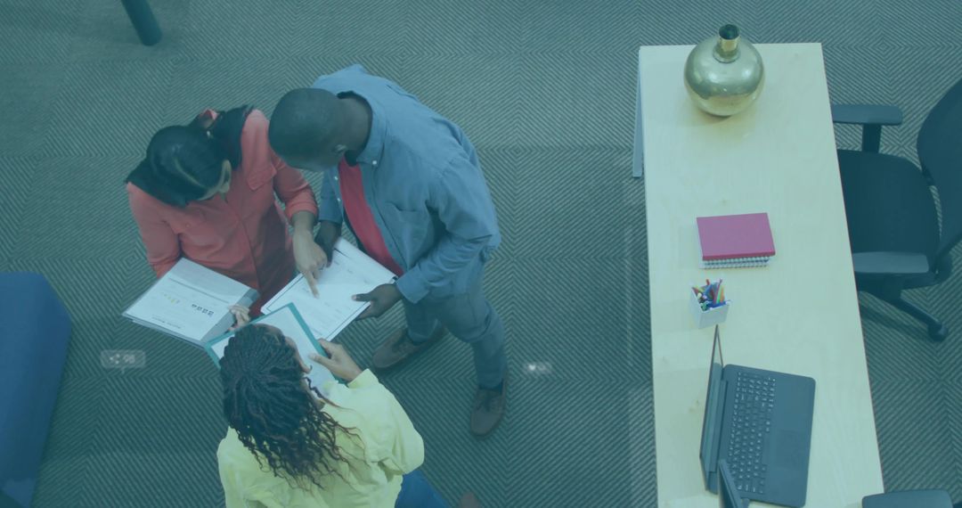 Creative Office Collaborators Reviewing Documents Together