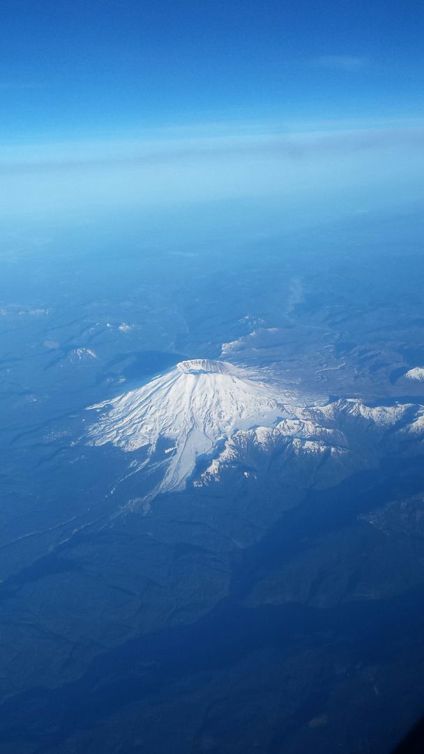 Aerial View of Snow-Covered Mountain Under Clear Blue Sky - Free Images, Stock Photos and Pictures on Pikwizard.com
