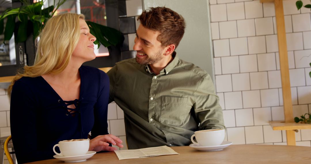 Affectionate Couple Enjoying Coffee at Cozy Cafe