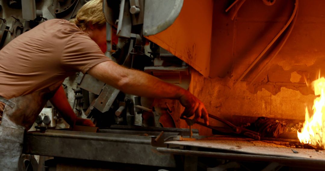 Factory Worker Managing Furnace Fire for Industrial Process - Free Images, Stock Photos and Pictures on Pikwizard.com