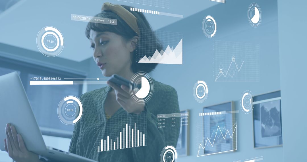 Businesswoman Analyzing Data with Digital Interface Display in Office