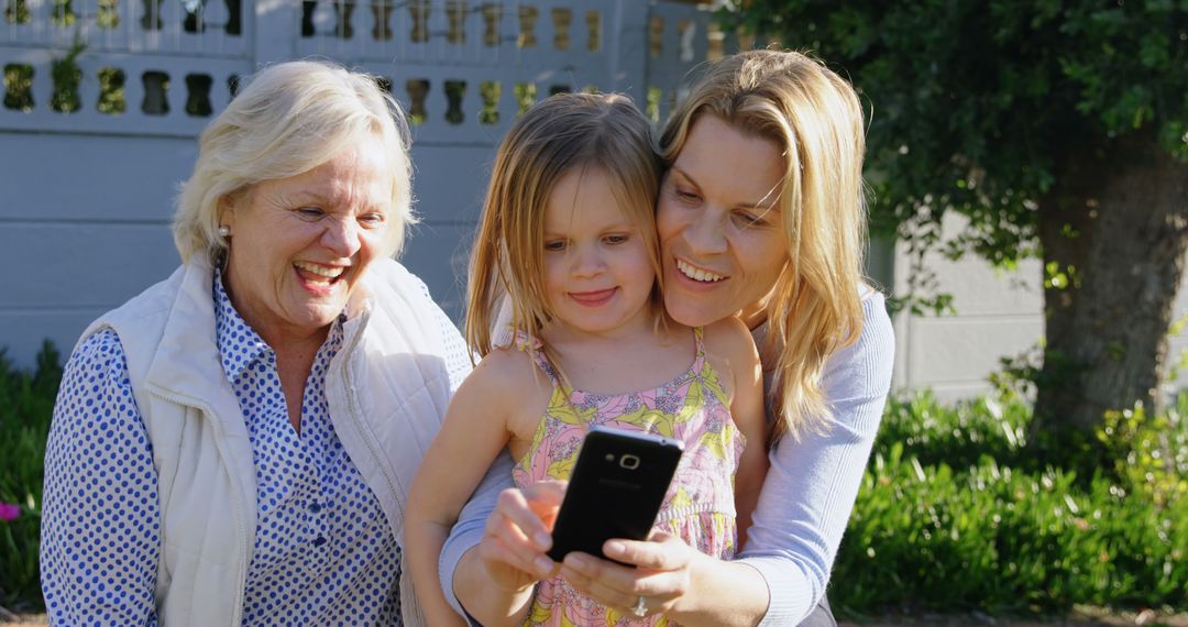 Three Generations of Women Taking Selfie Outdoors on Sunny Day - Free Images, Stock Photos and Pictures on Pikwizard.com