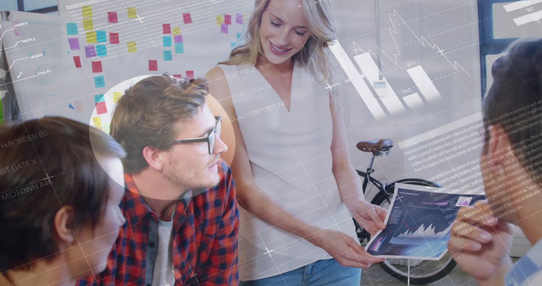 Diverse Team Analyzing Data in Modern Business Meeting