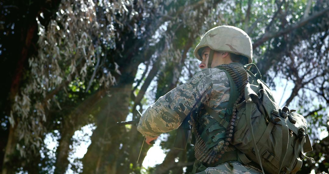 Female Soldier Navigating Forest in Camouflage Gear