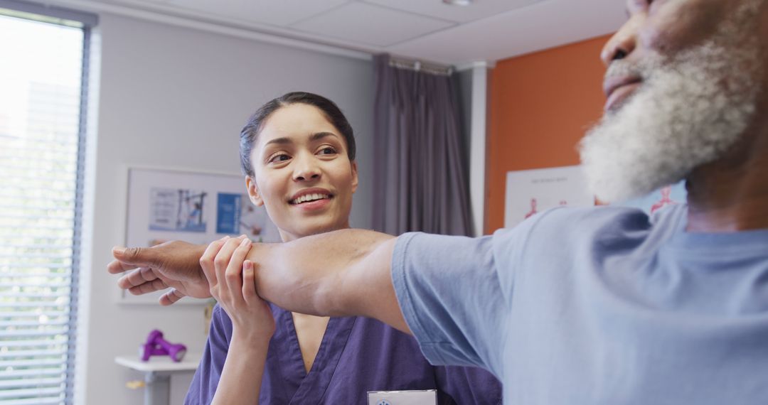 Physical Therapist Assisting Elderly Patient with Arm Exercises - Free Images, Stock Photos and Pictures on Pikwizard.com