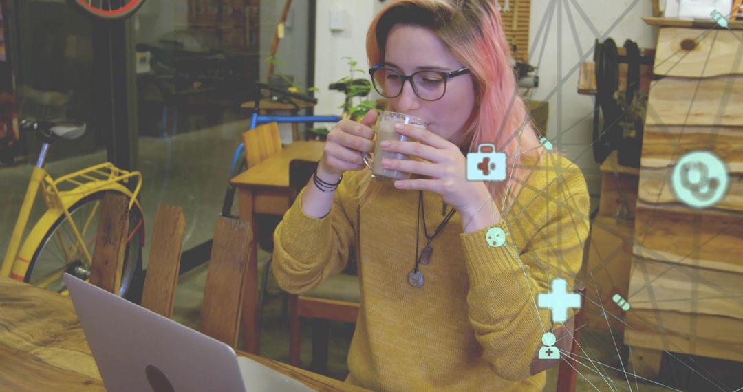 Woman Enjoying a Cozy Cafe Workspace with Technology Connection