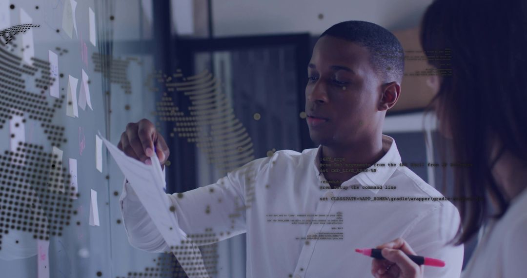 Colleagues Collaborating with Workflow Strategy in Modern Office