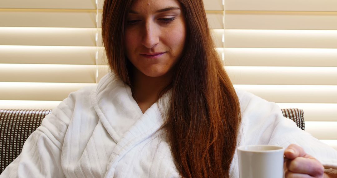 Woman Relaxing in Bathrobe with Coffee Cup at Home - Free Images, Stock Photos and Pictures on Pikwizard.com